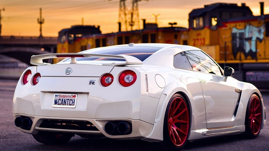 Sports car Nissan GTR white color with red disks