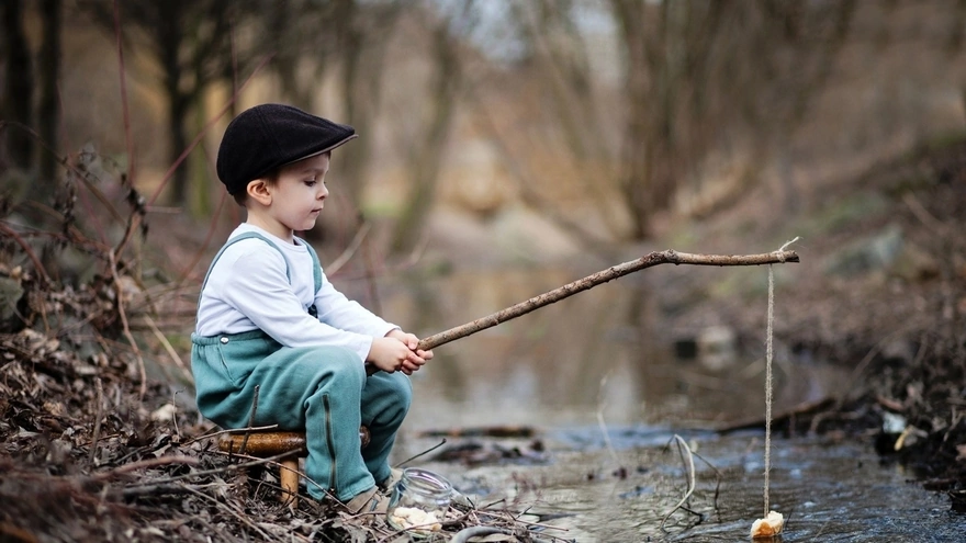 A boy plays in the fisherman