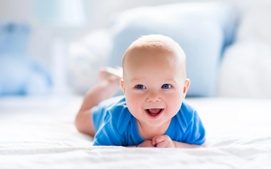 Blue-eyed baby smiling