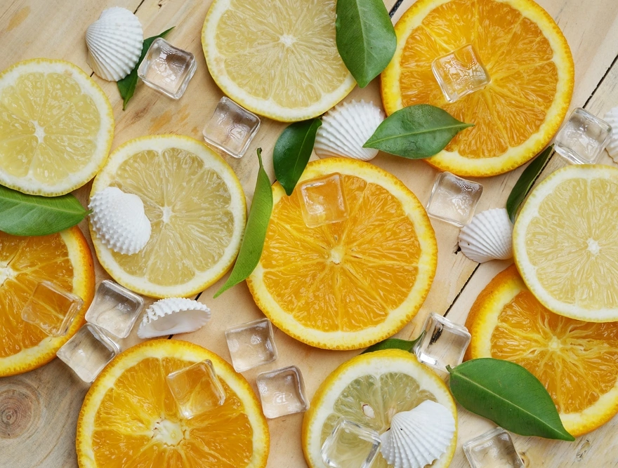 Slices of orange and lemon with ice cubes