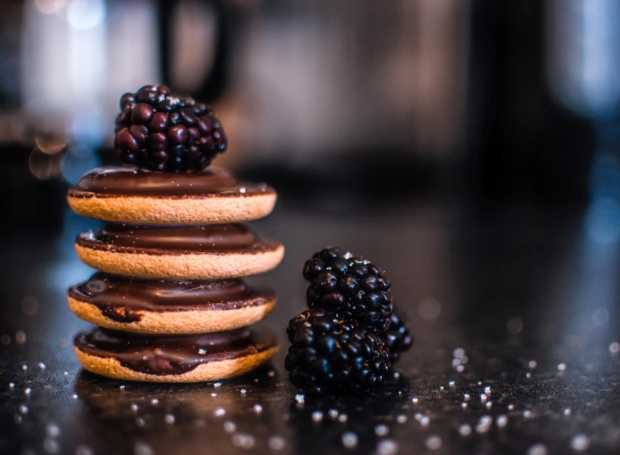 Biscuits in chocolate with blackberries
