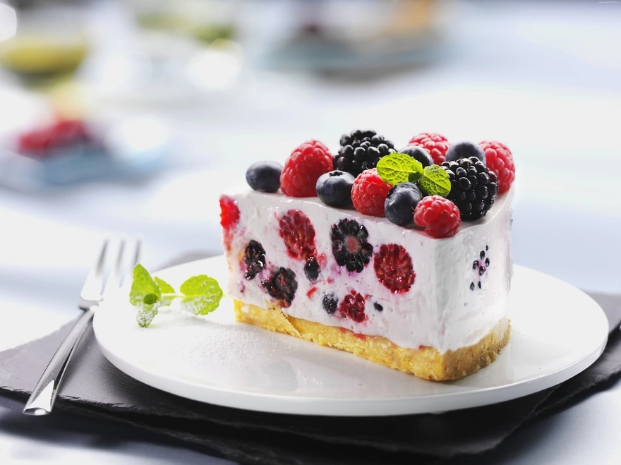 A delicious slice of cake with berries