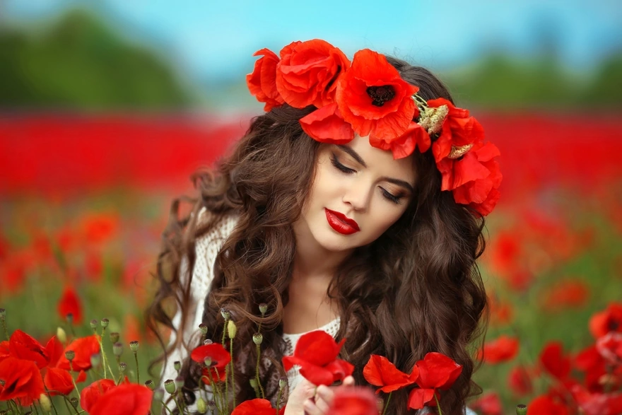 The girl adorned herself with a wreath of red poppies