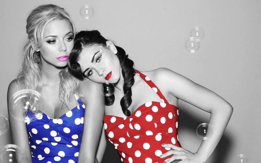 Blonde and brunette in dresses with white polka dots