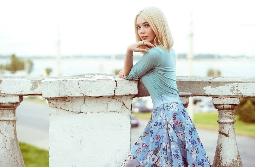 Blonde in a pale blue dress