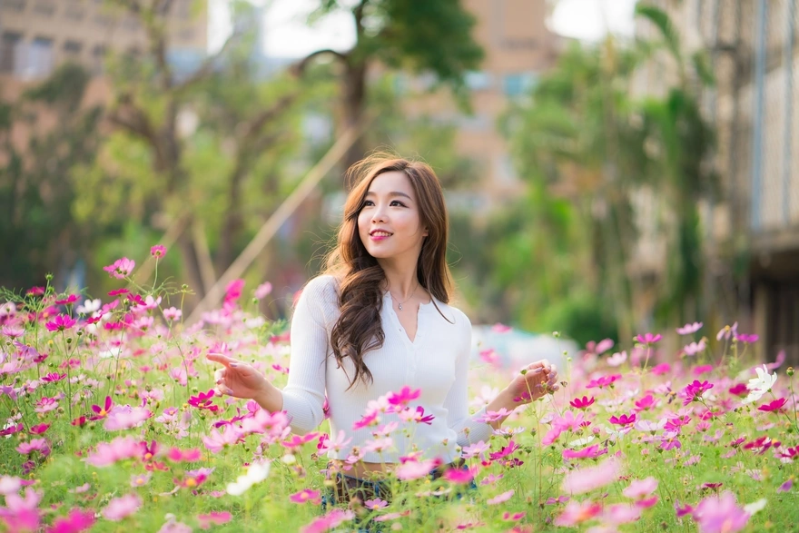Smiling girl in field of flowers