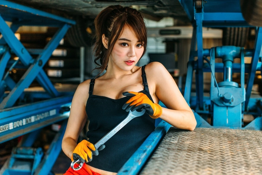Girl with a large wrench