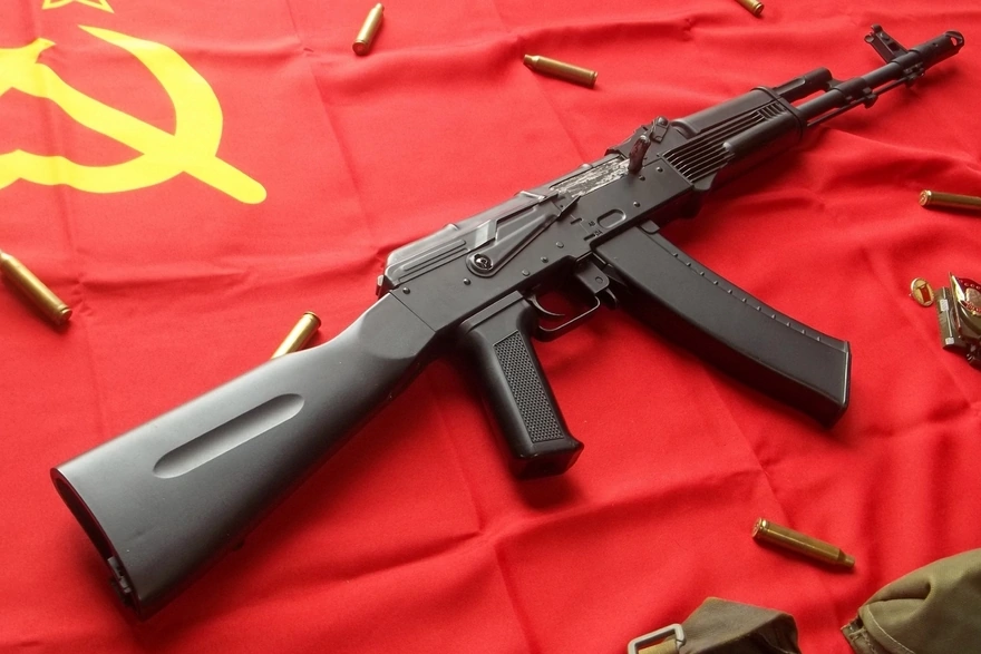 The Kalashnikov assault rifle on red flag of the USSR
