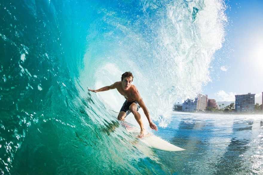 Male surfer under wave