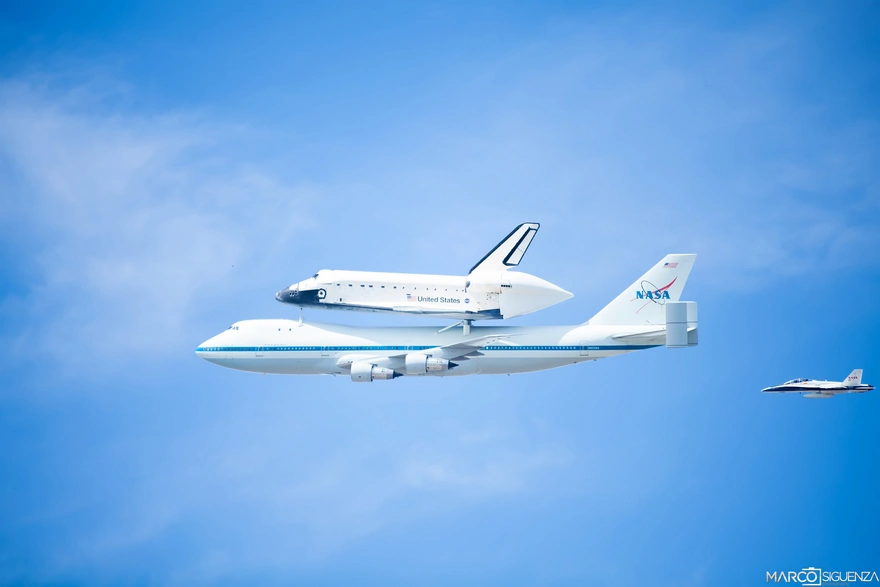 Boeing and the Shuttle flying in the sky