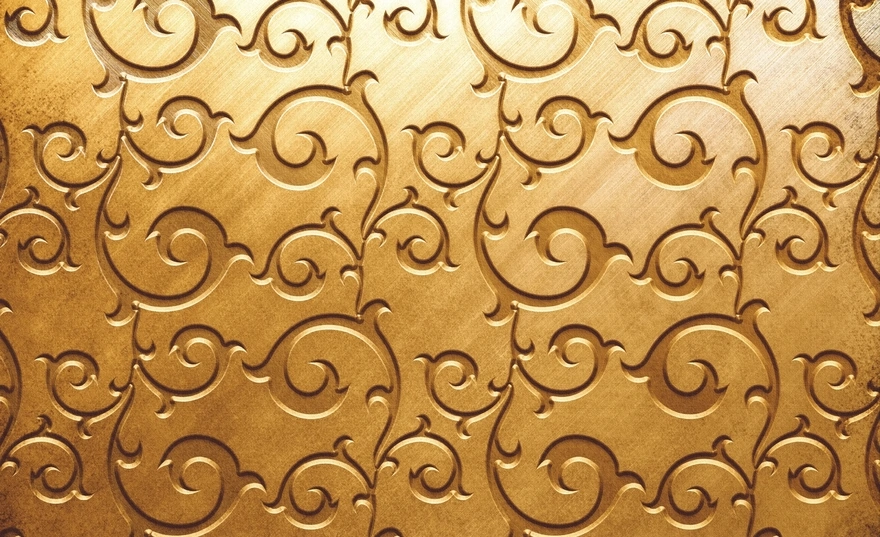 Golden background with a pattern of swirls