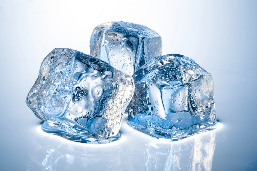 Three ice cubes are melting