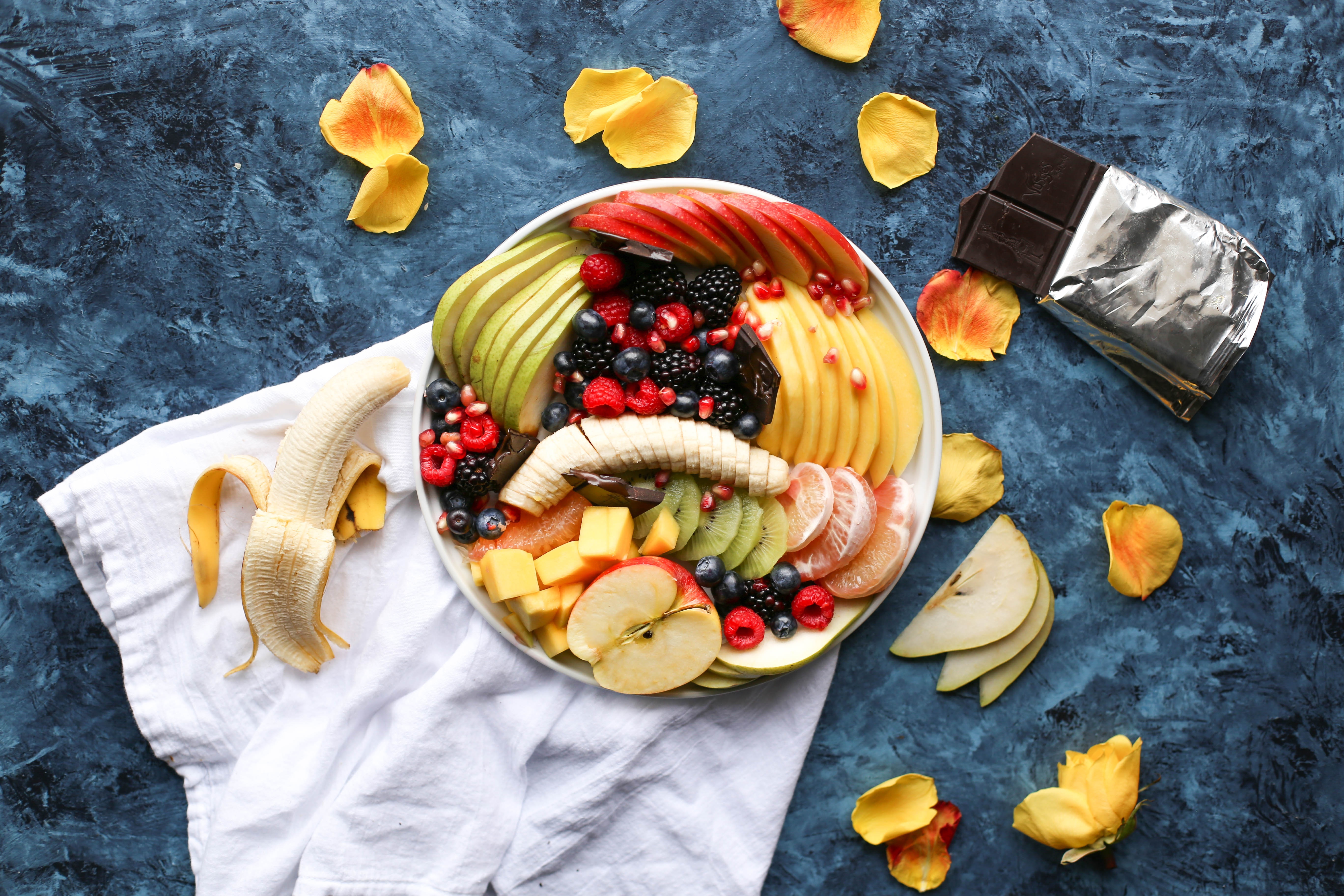 Image: Food, fruit, pieces, chocolate, cloth, table, banana, berries, petals