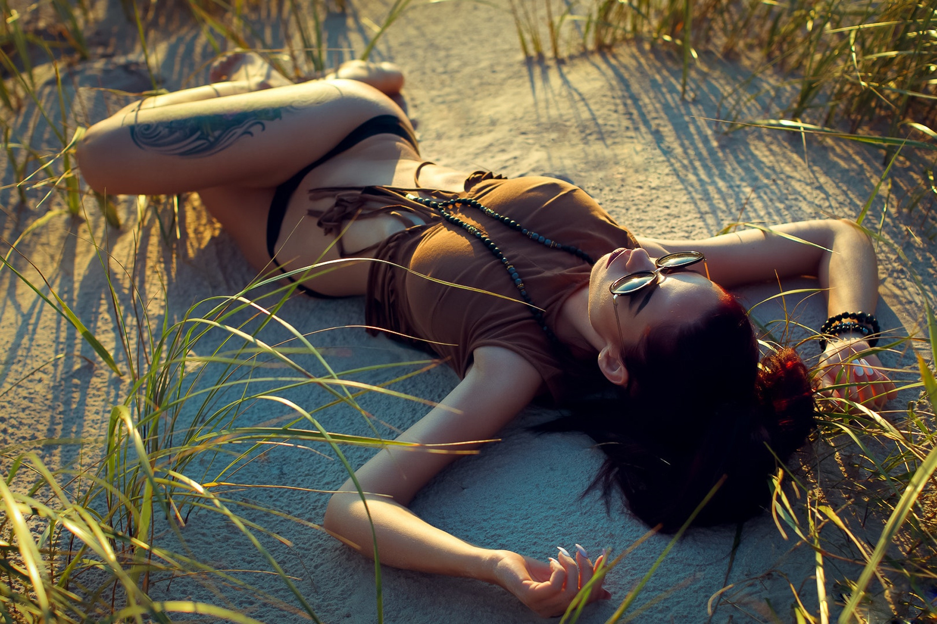 Image: Girl, lying, sand, grass, tattoo, glasses, brunette