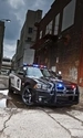 Картинка: Полицейская машина в переулке.