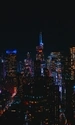 Image: Night city with glowing windows