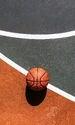 Картинка: Баскетбольный мяч на грунтовой площадке