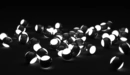 Image: Black and white glowing balls.