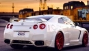 Image: Sports car Nissan GTR white color with red disks