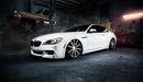 Image: White BMW m6 in the garage.