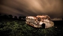 Image: Old rusty car in nature
