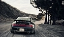 Картинка: Тёмный Porsche Carrera в пути.