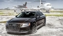 Image: The Audi RS7 on the background of aircraft.