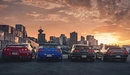 Картинка: Четыре автомобиля марки Nissan на парковке