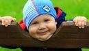 Image: The little boy smiles sweetly.