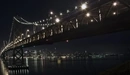 Картинка: Мост с включёнными огнями ночью.