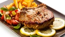 Image: Delicious pork loin on the bone with vegetables
