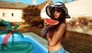 Картинка: Девушка в шляпке и очках с долькой арбуза у бассейна