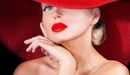 Image: Blonde in a red hat.