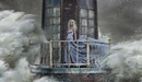 Image: A girl in a blue dress standing on the balcony of the lighthouse.