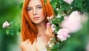 Картинка: Рыжеволосая девушка с веснушками на лице