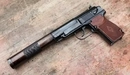 Image: A Makarov pistol with a silencer.