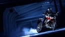 Image: A motorcyclist rides in the tunnel on the Kawasaki