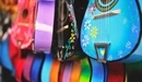 Image: Assortment of colored guitars with painted flowers.