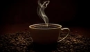 Картинка: Чашечка ароматного напитка стоит в зёрнах кофе.