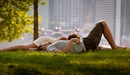 Image: A couple enjoying a day at the city's green lawn.