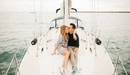 Image: A romantic walk on a yacht loving couple