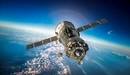 Картинка: Космический корабль Союз летает в атмосфере над Землёй.