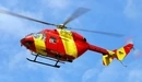 Картинка: Вертолёт жёлто-красного цвета летит в небе