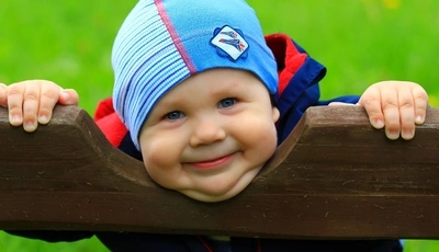 Image: Boy, kid, child, smile, mood, bench