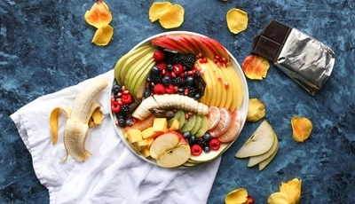 Image: Food, fruit, pieces, chocolate, cloth, table, banana, berries, petals