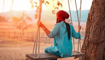 Image: Girl, swing, red hat, clock, tree, field