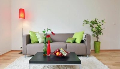 Image: Диван, столик, подушки, фрукты, лампа, ковёр, цветы