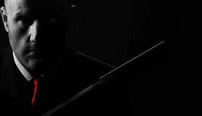 Image: Man, gun, black, silencer, dark, face, stubble, tie