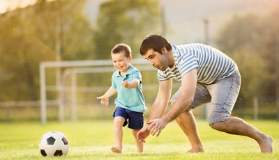 Image: Male, child, father, son, play, ball, football, gate, running, entertainment