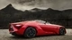 Картинка: Ярко-красный суперкар на фоне гор
